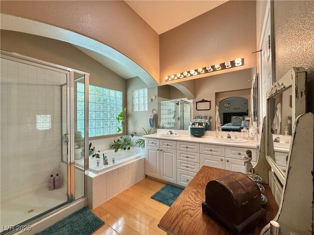 2986 Matese Dr, Henderson, NV 89052 - bathroom featuring a sink, wood-type flooring, a shower stall, and a garden tub
