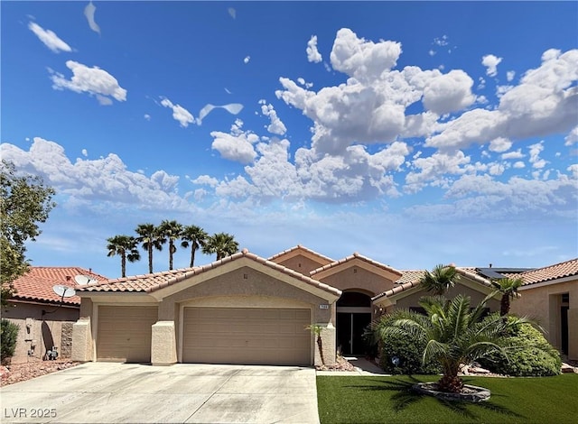 2986 Matese Dr, Henderson, NV 89052 - mediterranean / spanish-style house with an attached garage, stucco siding, driveway, and a tiled roof