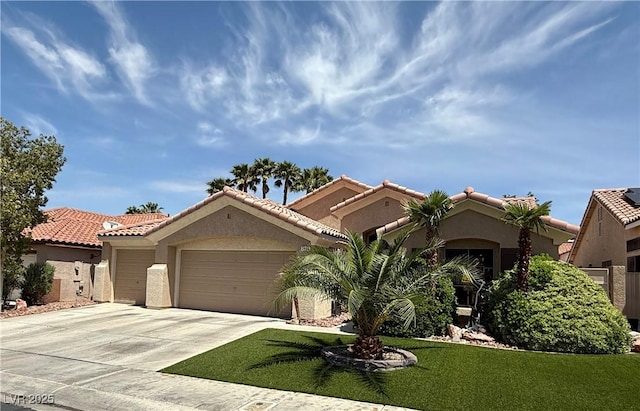 2986 Matese Dr, Henderson, NV 89052 - mediterranean / spanish home featuring a front lawn, an attached garage, concrete driveway, and stucco siding
