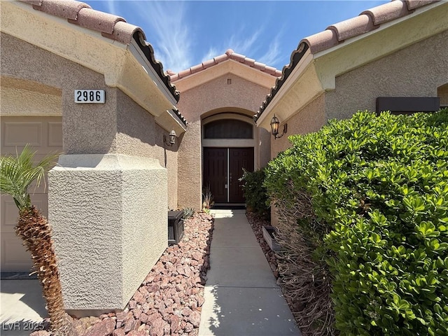 2986 Matese Dr, Henderson, NV 89052 - property entrance featuring stucco siding and a tiled roof