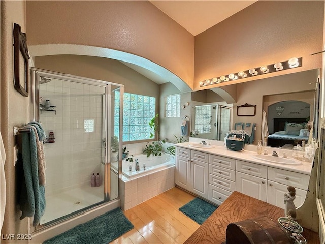 2986 Matese Dr, Henderson, NV 89052 - bathroom with a sink, a bath, wood finished floors, and a shower stall