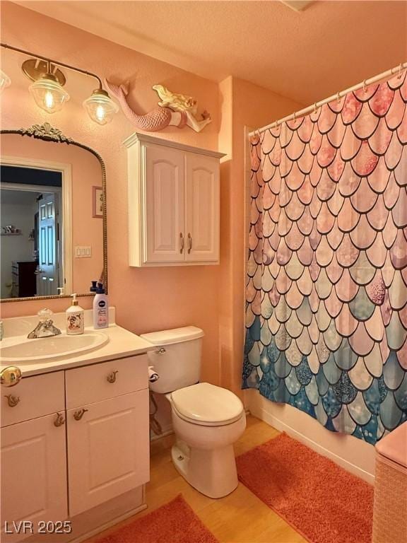 2986 Matese Dr, Henderson, NV 89052 - bathroom with vanity, toilet, and wood finished floors