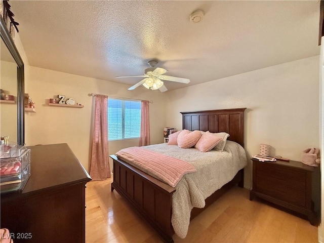2986 Matese Dr, Henderson, NV 89052 - bedroom with ceiling fan, light wood finished floors, and a textured ceiling