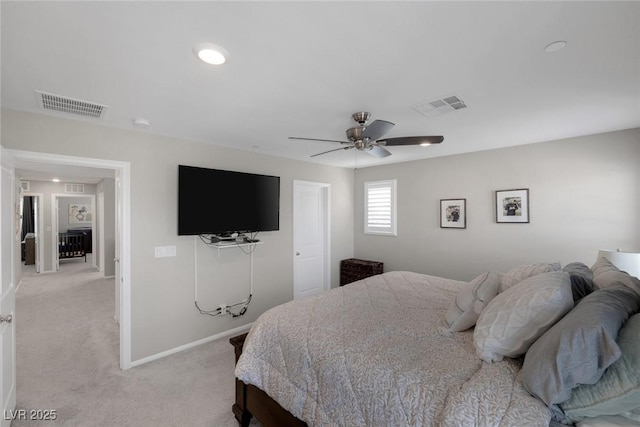 bedroom featuring light colored carpet, visible vents, ceiling fan, and baseboards