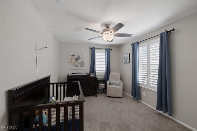 carpeted bedroom featuring a ceiling fan and baseboards