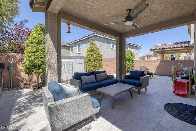 view of patio / terrace with ceiling fan, an outdoor hangout area, and a fenced backyard
