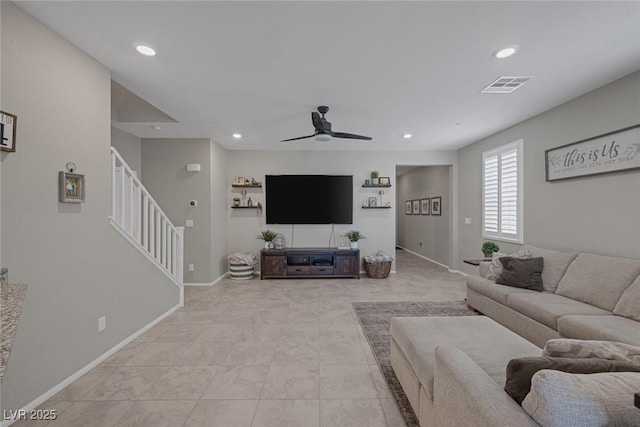 living area with recessed lighting, a ceiling fan, visible vents, stairs, and baseboards