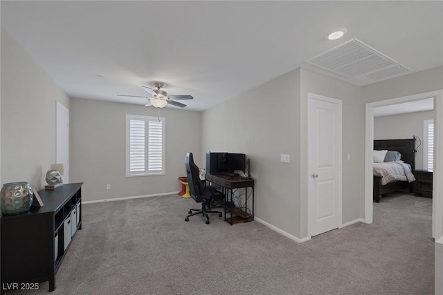 office with baseboards, visible vents, a ceiling fan, and carpet