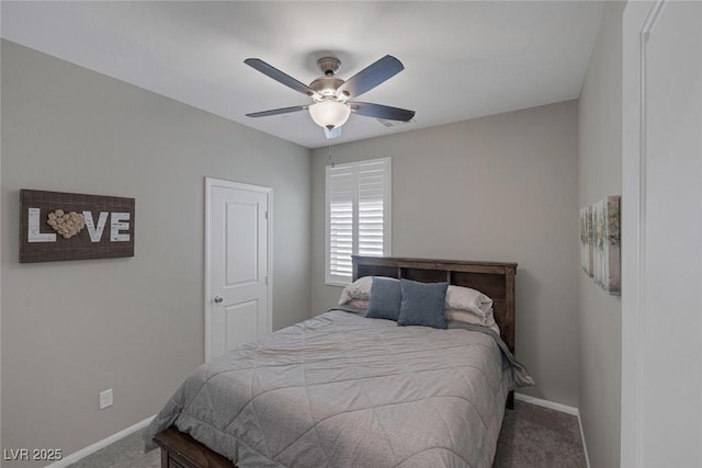 carpeted bedroom featuring ceiling fan and baseboards