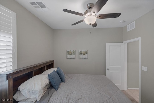 carpeted bedroom featuring visible vents and ceiling fan