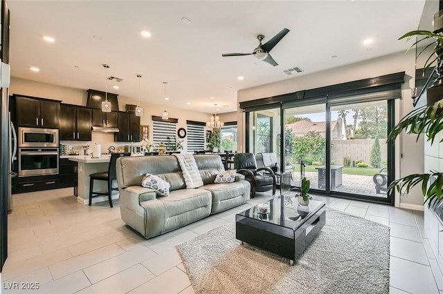 living area featuring visible vents, recessed lighting, ceiling fan, and light tile patterned floors