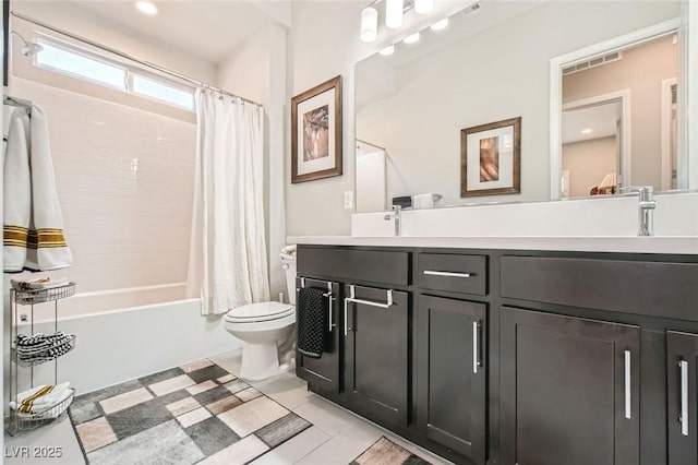 full bathroom with tile patterned flooring, double vanity, shower / tub combo with curtain, toilet, and a sink