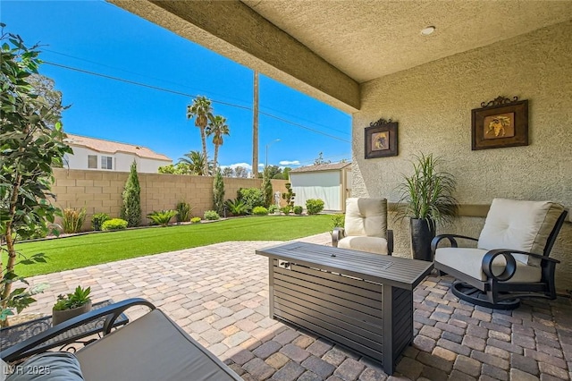 view of patio featuring fence