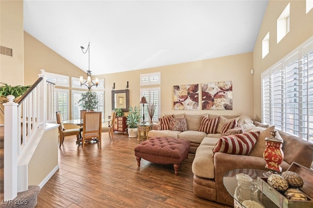 3295 Cooper Creek Dr, Henderson, NV 89074 - living room with stairway, wood-type flooring, visible vents, a notable chandelier, and high vaulted ceiling