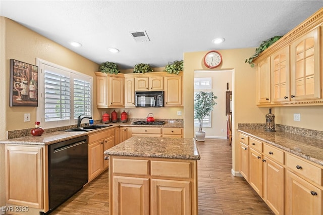 3295 Cooper Creek Dr, Henderson, NV 89074 - kitchen featuring black appliances, light brown cabinetry, and a sink