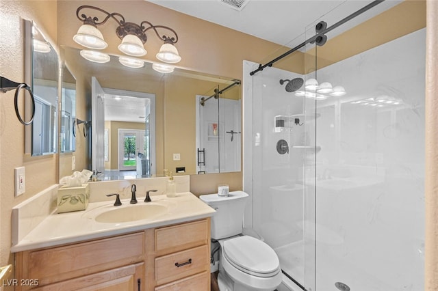 3295 Cooper Creek Dr, Henderson, NV 89074 - bathroom featuring toilet, a shower stall, and vanity