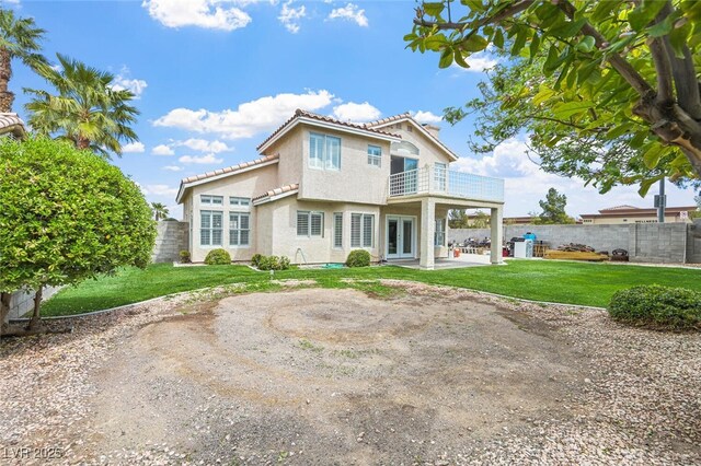 3295 Cooper Creek Dr, Henderson, NV 89074 - back of house with a patio area, a balcony, a yard, a fenced backyard, and a tiled roof