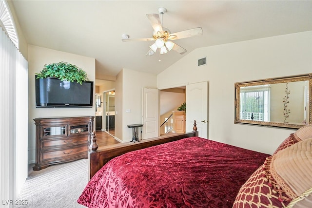 3295 Cooper Creek Dr, Henderson, NV 89074 - bedroom with carpet, ensuite bathroom, visible vents, a ceiling fan, and lofted ceiling