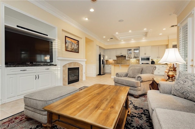 living area featuring recessed lighting, a fireplace, light tile patterned floors, visible vents, and ornamental molding