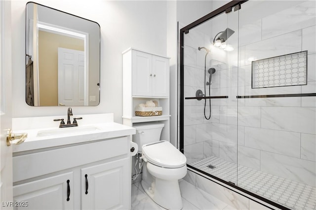 bathroom with toilet, a stall shower, marble finish floor, and vanity