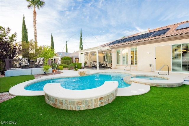 view of swimming pool with a patio, a yard, a pool with connected hot tub, and fence