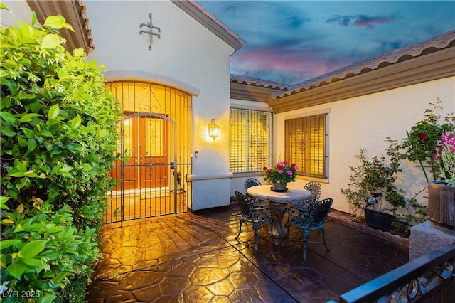 view of patio terrace at dusk