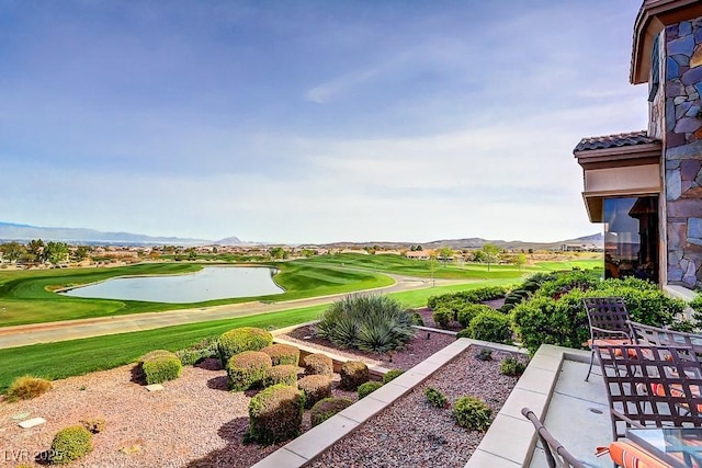 view of home's community featuring a water and mountain view and golf course view