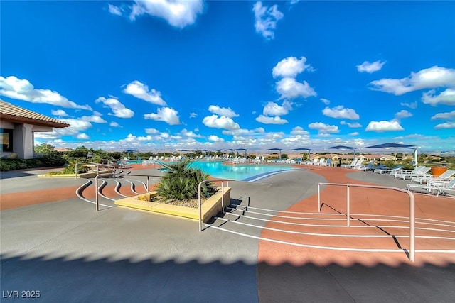 view of home's community with a swimming pool