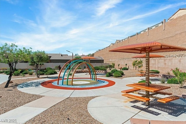 view of home's community with fence