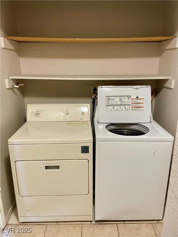4682 Tamalpias Ave, Las Vegas, NV 89120 - laundry area featuring light tile patterned floors and washer and clothes dryer