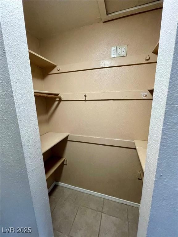 4682 Tamalpias Ave, Las Vegas, NV 89120 - walk in closet with tile patterned flooring