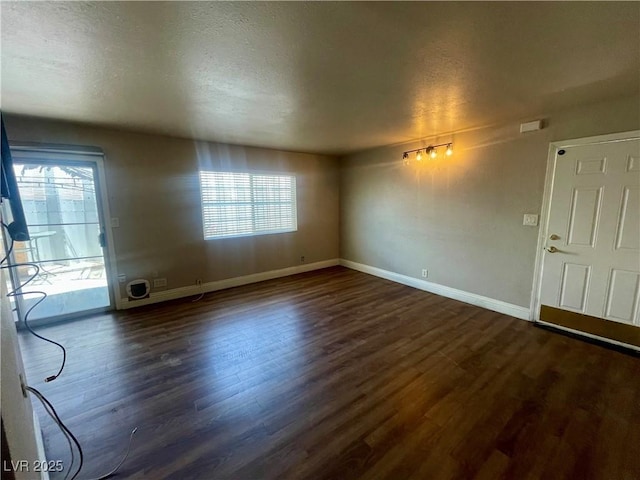 4682 Tamalpias Ave, Las Vegas, NV 89120 - unfurnished living room with dark wood finished floors and a textured ceiling