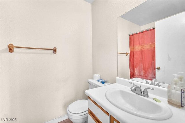 719 Roberta Alecia Ave, North Las Vegas, NV 89031 - full bathroom with toilet, vanity, and a shower with curtain
