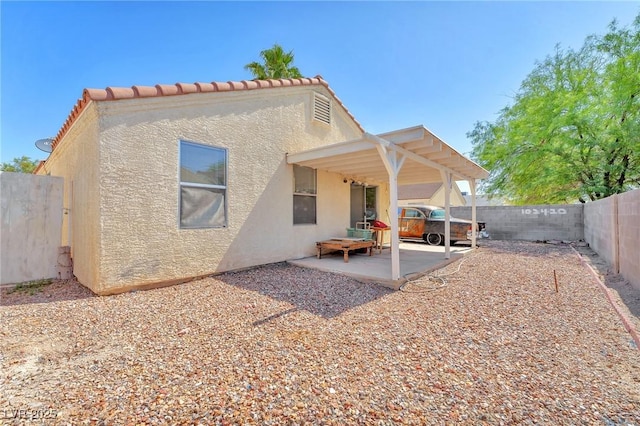 719 Roberta Alecia Ave, North Las Vegas, NV 89031 - back of house with stucco siding, a fenced backyard, and a patio area