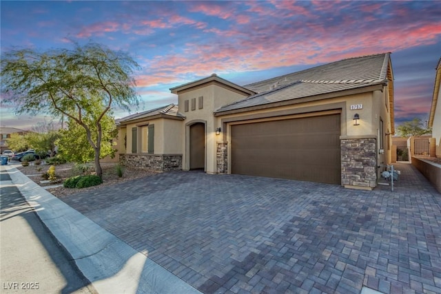 8797 Pinley Spring St, Las Vegas, NV 89113 - view of front of property featuring stone siding, stucco siding, and a garage