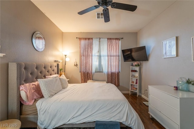 bedroom featuring baseboards, a ceiling fan, dark wood-style flooring, and visible vents
