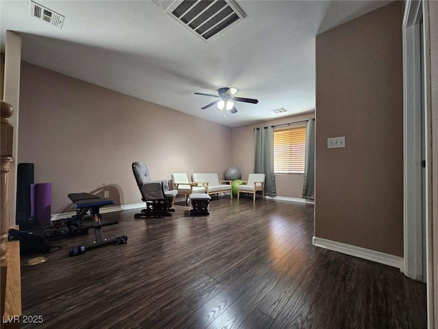 sitting room with wood finished floors, visible vents, ceiling fan, and baseboards
