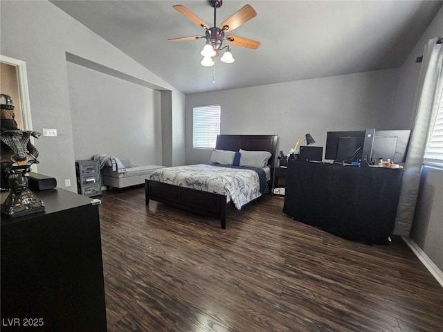 bedroom featuring a ceiling fan, vaulted ceiling, wood finished floors, and baseboards