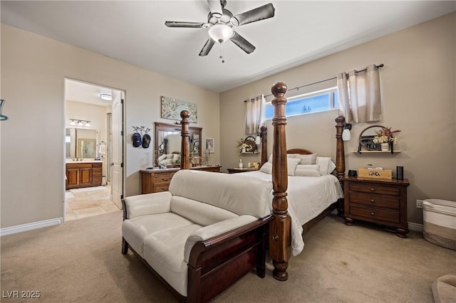1981 Trophy Elk Ave, Logandale, NV 89021 - bedroom featuring baseboards, ceiling fan, ensuite bath, and light colored carpet