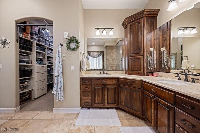 1981 Trophy Elk Ave, Logandale, NV 89021 - full bath with double vanity, a walk in closet, and a sink