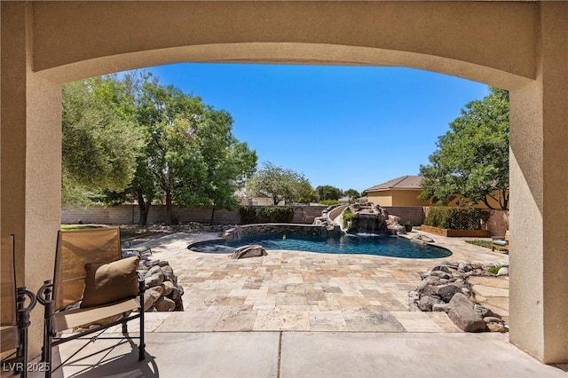 1981 Trophy Elk Ave, Logandale, NV 89021 - view of pool featuring a water slide, a fenced backyard, a fenced in pool, and a patio area