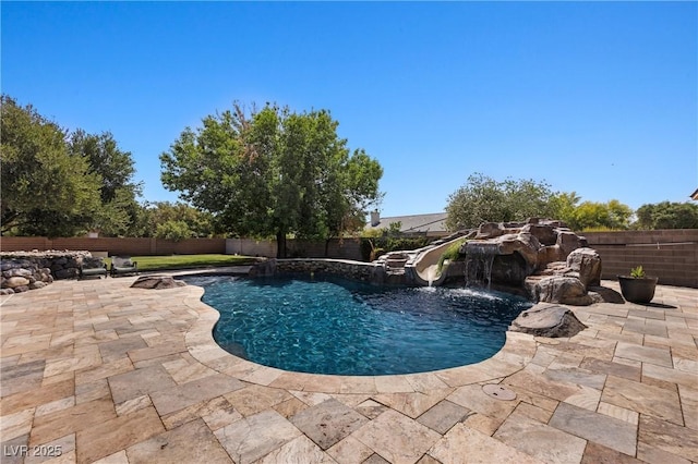 1981 Trophy Elk Ave, Logandale, NV 89021 - view of swimming pool with a patio, a fenced backyard, a water slide, and a fenced in pool