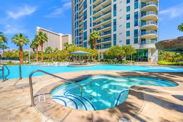 community pool with a patio area