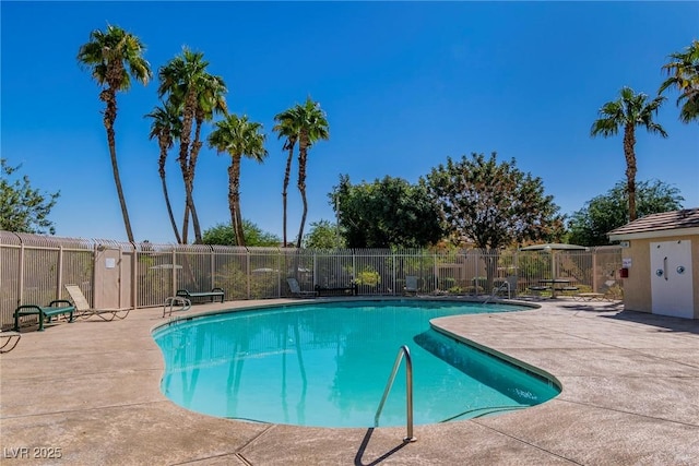 pool featuring a patio and fence
