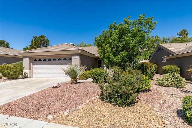 2078 Joy Creek Ln, Henderson, NV 89012 - ranch-style home featuring a tile roof, driveway, a garage, and stucco siding