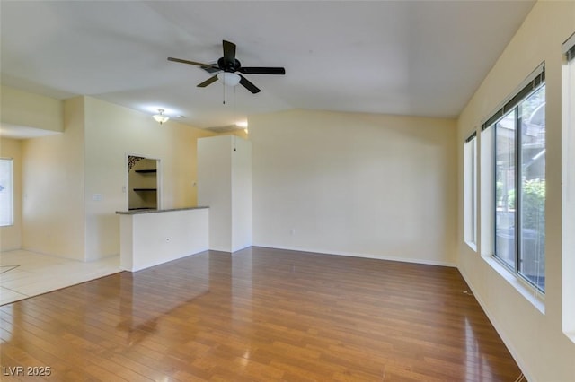 2078 Joy Creek Ln, Henderson, NV 89012 - spare room featuring ceiling fan, wood finished floors, and baseboards