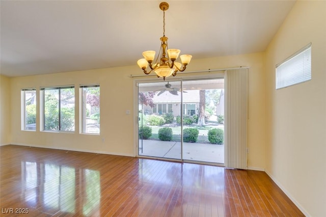2078 Joy Creek Ln, Henderson, NV 89012 - spare room with an inviting chandelier, hardwood / wood-style flooring, and baseboards