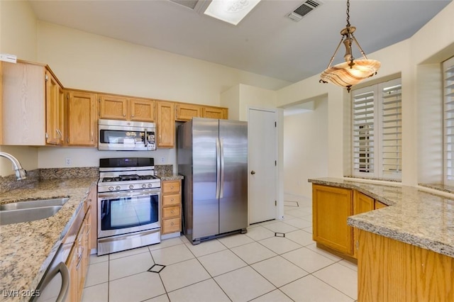 2078 Joy Creek Ln, Henderson, NV 89012 - kitchen featuring light stone countertops, a sink, stainless steel appliances, visible vents, and decorative light fixtures