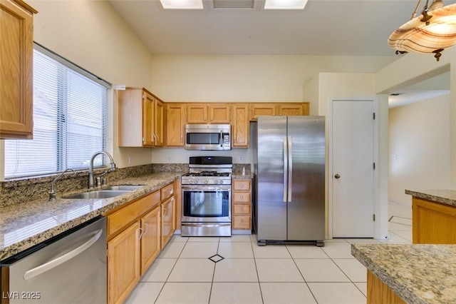 2078 Joy Creek Ln, Henderson, NV 89012 - kitchen featuring light tile patterned floors, light stone counters, appliances with stainless steel finishes, and a sink