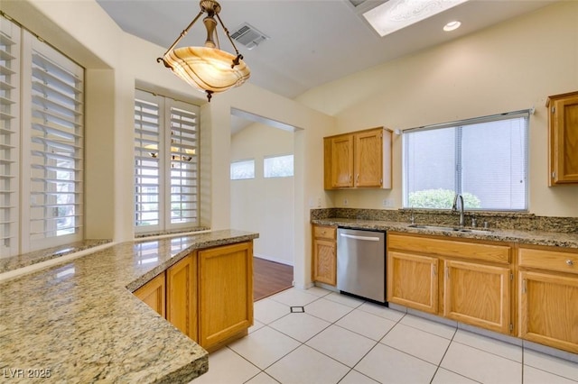 2078 Joy Creek Ln, Henderson, NV 89012 - kitchen featuring light stone countertops, a sink, visible vents, dishwasher, and lofted ceiling